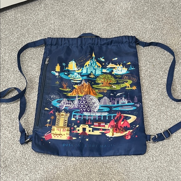 Disney Handbags - Disney Navy Blue Drawstring Bag with Colorful Park Design